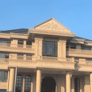 盐城黄金麻别墅外墙干挂石材效果示例